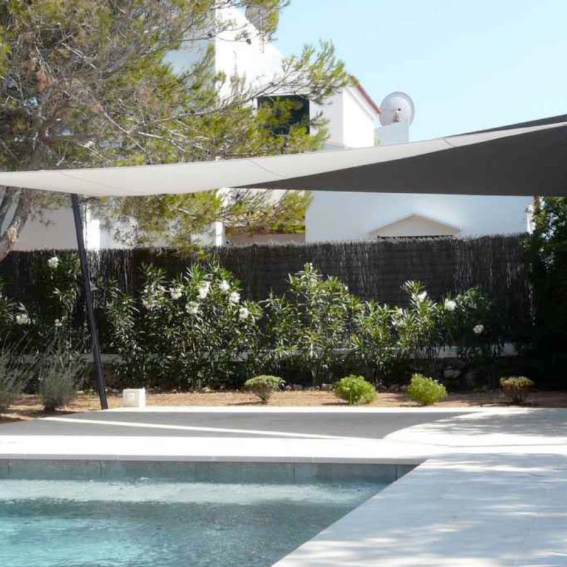 Roller shade sail by the pool