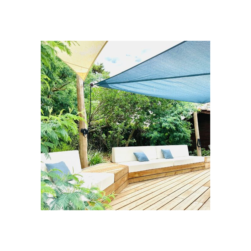 Microperforated roller shade sails on acacia wooden mats