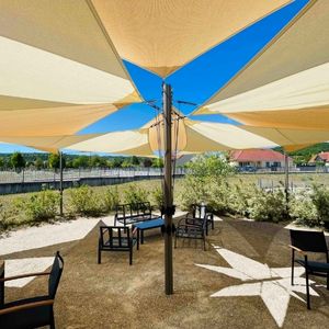 Openwork shade sail with pole