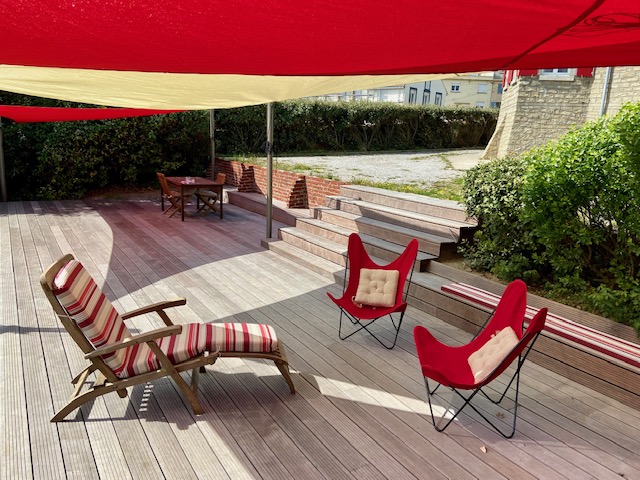 A warm and friendly living space under shade sails