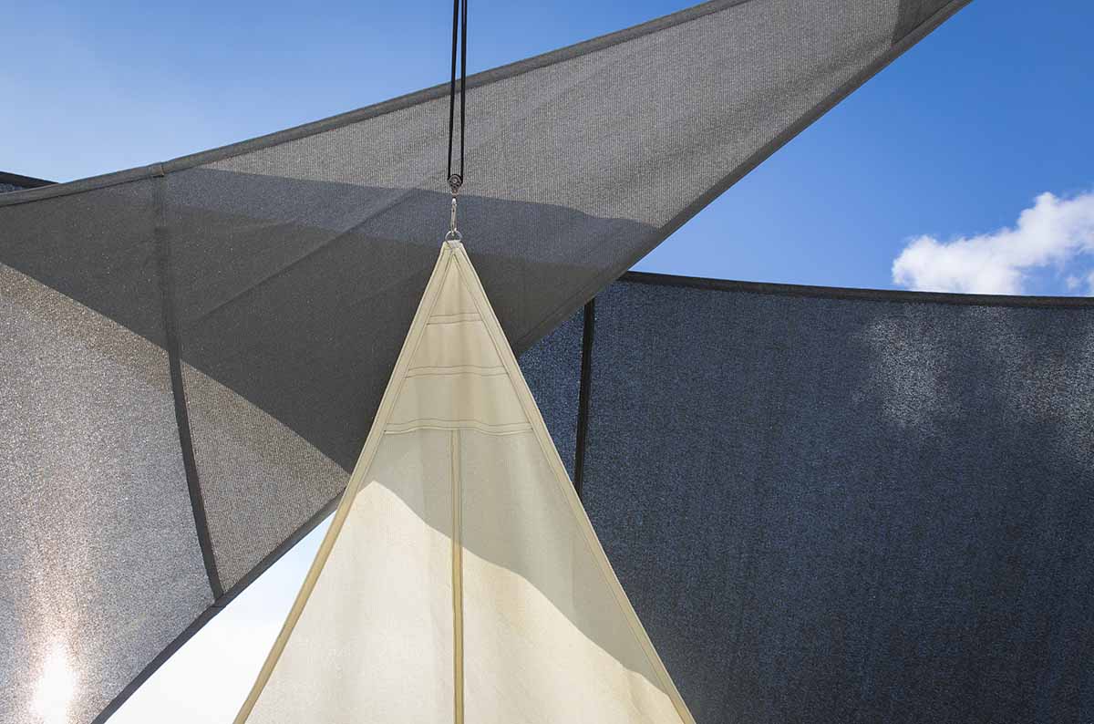 Overlapping shade sails in different colours